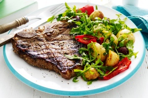 Garlic and rosemary T-bone steaks with warm potato salad