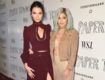 Kendall Jenner, left, and Kylie Jenner arrive at the special screening of "Paper Towns" held at The London Hotel on Saturday, July 18, 2015, in West Hollywood, Calif.