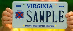 405136 01: Brag Bowling, First Lieutenant Commander Of The Sons Of Confederate Veterans Virginia Division, Holds A Sample Virginia Licence Plate Containing His Organization's Logo, Which Incorporates The Confederate Battle Flag, May 8, 2002 In Richmond, Va. A Federal Appeals Court Ruled Last Week That Virginia Cannot Block The Group From Displaying The Logo On Speciality License Plates. The 4Th U. S. Circuit Court Of Appeals Ruled Against The State's Claim That The Licence Plates Constitute Public Speech And That The State Had The Right To Regulate Which Groups And Designs Are Allowed On Plates That Represent Virginia. Bowling Said His Group Hopes To Have Their Plates By Mid-Summer.  (Photo By Wayne Scarberry/Getty Images)