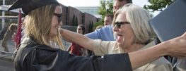 Family congratulating after graduation