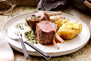 Roasted lamb rack with Greek chimichurri and haloumi potatoes