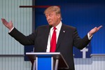 Republican presidential candidate Donald Trump gestures during the first Republican presidential debate at the Quicken Loans Arena Thursday, Aug. 6, 2015, in Cleveland.