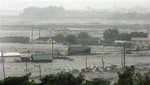 A town is heavily flooded following a heavy rain brought by typhoon Morakot, Saturday, August 8, 2009, in Taitung county, southern East of Taiwan