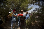 Palestinians carry the body of one-and-a-half year old boy, Ali Dawabsheh, during his funeral in Duma village near the West Bank city of Nablus, Friday, July 31, 2015.