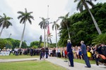 U.S. Secretary of State John Kerry and Chargé d'affaires DeLaurentis watch as Marines raise the American flag at the Ambassador's residence in Havana, Cuba, on August 14, 2015.