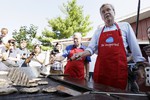 Republican presidential candidate, former Florida Gov. Jeb Bush, works the grill in the Iowa Pork Producers tent during a visit to the Iowa State Fair, Friday, Aug. 14, 2015, in Des Moines, Iowa.