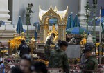 Police investigate the scene around the Erawan Shrine the morning after an explosion in Bangkok,Thailand, Tuesday, Aug. 18, 2015.