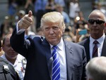 Donald Trump gives a thumbs-up as he leaves for lunch after being summoned for jury duty in New York, Monday, Aug. 17, 2015.