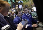 Traders work on the floor of the New York Stock Exchange Wednesday, April 28, 2010