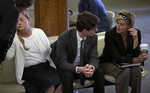 Owen Labrie huddles with one of his attorneys Jaye Rancourt, right, and his parents Denise Holland and Cannon Labrie in the lobby of the Merrimack County Superior Court in Concord, New Hampshire Friday morning as they await the verdict. Labrie is on trial for the rape of a fellow St. Paul's student in May of 2014.