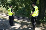 Railway guards patrolling tracks to prevent gold hunters and history buffs from getting harmed by passing trains near the site where two men allegedly found a Nazi gold train hidden underground near Walbrzych, Poland, on Monday, Aug. 31, 2015.