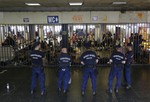 Hungarian policemen guard an entrance to the Keleti Railway Station in Budapest, Hungary, Wednesday, Sept. 2, 2015, as hundreds of migrants demanded to be let on trains to Germany.