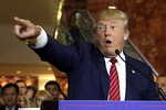 Republican presidential candidate Donald Trump calls on a questioner during a news conference at Trump Tower, in New York, Thursday, Sept. 3, 2015.