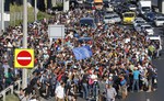 Migrants walk out of Budapest, Hungary, Friday, Sept. 4, 2015. Over 150,000 people seeking to enter Europe have reached Hungary this year.