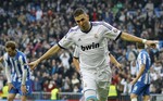 Real Madrid's Karim Benzema from France celebrates scoring the opening goal during a Spanish La Liga soccer match against Real Sociedad at the Santiago Bernabeu stadium in Madrid, Spain, Sunday, Jan. 6, 2013.