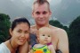 Simon Dilks with his wife and daughter against the mountainous scenery of their home.