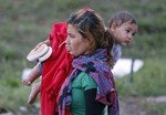 Migrants arrive at the border Hungary to Austria, Saturday, Sept. 5, 2015.