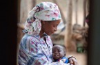 A Mother Holds A Crying Child