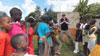 Tim with children from cancer ward in Tanzania.