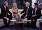 Elisabeth Hasselbeck appears with co-hosts Steve Doocy, left, and Brian Kilmeade, right, as Donald Trump is interviewed during her debut on the "Fox & Friends" television program, in New York Monday, Sept. 16, 2013.