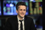 Box, Inc. Chairman, CEO & co-founder Aaron Levie is interviewed on the floor of the New York Stock Exchange, Friday, Jan. 23, 2015. Box Inc. shares soared 56 percent in their stock market debut, after the online storage provider raised $175 million in its initial public offering. (AP Photo/Richard Drew)