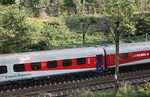 A local train passes near the site where allegedly a Nazi gold train is hidden in a collapsed tunnel in Walbrzych, Poland, Tuesday, Sept. 1, 2015.