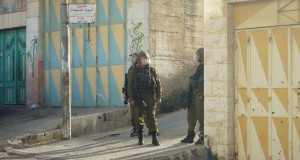 Soldiers pictured shortly after having charged at schoolchildren, yelling and throwing a soundbomb