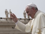 Pope Francis waves after his weekly general audience in St. Peter's Square at the Vatican, Wednesday, Sept. 9, 2015.