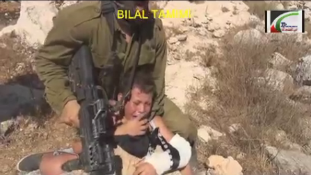 Soldier attacking injured child (image from video by Bilal Tamimi)