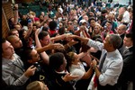 President Barack Obama shakes hands with audience members following an education town hall at North High School in Des Moines, Iowa, Sept. 14, 2015.