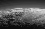 Majestic Mountains and Frozen Plains: Just 15 minutes after its closest approach to Pluto on July 14, 2015, NASA’s New Horizons spacecraft looked back toward the sun and captured this near-sunset view of the rugged, icy mountains and flat ice plains extending to Pluto’s horizon.