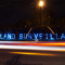 The Overpass Light Brigade holds lit signs by a roadside reading "Homeland Surveillance" on May 5, 2012. (Flickr / Light Brigading)