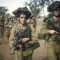 Two heavily armed soldiers from the Israel Defense Forces walk ahead of the rest of their troop during a training mission in the occupied Golan Heights on October 30, 2014. Julian Assange, WikiLeaks founder, said U.S. intelligence cables revealed a collaboration between the US, Israel and their allies to destabilize Syria that dates back to 2006, with Israel hoping to maintain its hold on this occupied territory through provoking Syrian civil war. (Flickr / Israel Defense Forces / Gadi Yampel)