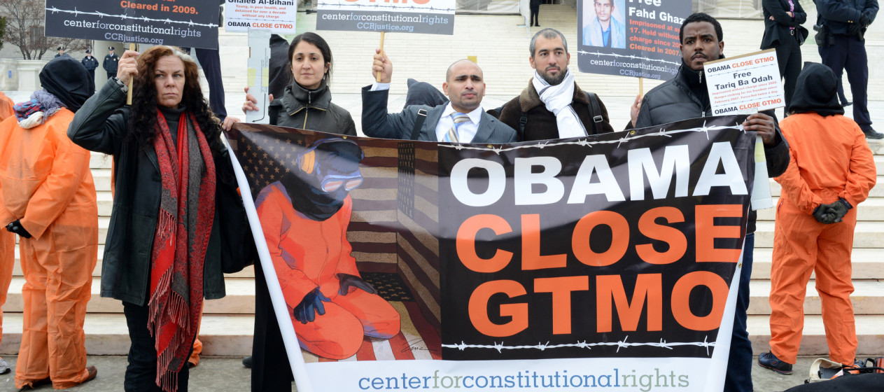 Activists rallied in front of the Supreme Court on January 11, 2013. Some wore orange prisoner jumpsuits with hoods and two hold a banner that reads "Obama Close GTMO." (Flickr / Stephen Melkisethian)