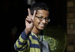 Ahmed Mohamed, 14, gestures as he arrives to his family's home in Irving, Texas, Thursday, Sept. 17, 2015.