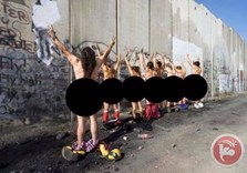 Activists strip against Israeli separation wall in Bethlehem