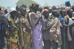 In this photo taken on Saturday, July 25, 2015, People wait for food distribution in Dablual, South Sudan.