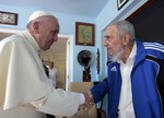 Pope Francis and Cuba's Fidel Castro shake hands, in Havana, Cuba, Sunday, Sept. 20, 2015.