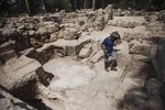 A worker for the Israel Antiquities Authority walks at an archeological site at Ben Shemen Forest near the Israeli city of Modiin on Monday, Sept. 21, 2015.