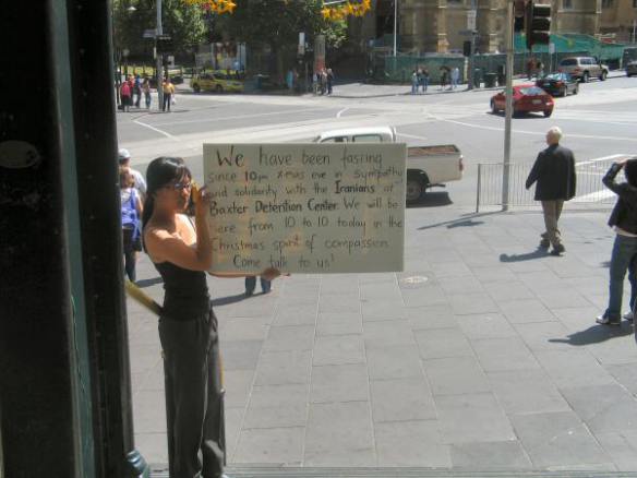 Juliana with placard explaining protest in more detail