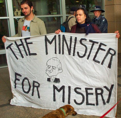 Banner depicting Ruddock - Minister for Misery