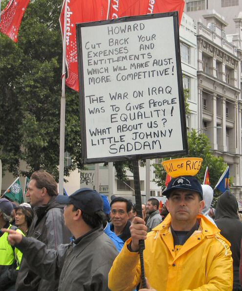 Man with 'bowl of rice' on head and anti-Howard placard