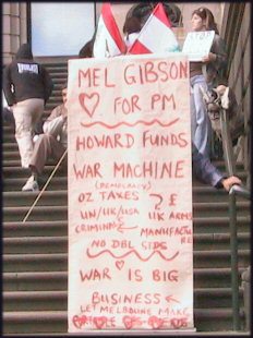 Placard linking war and big business