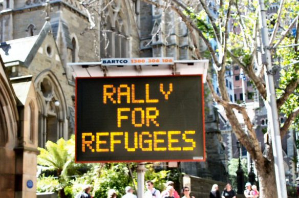 Illuminated road sign - Rally for Refugees