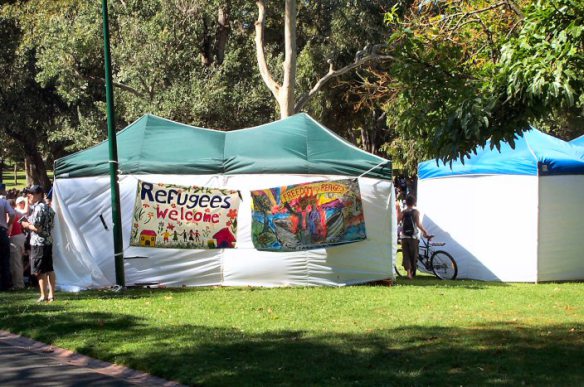 Tents at the Treasury Gardens, including RAC-Vic stall with banners welcoming refugees