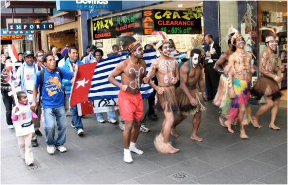 March led by dancers and West Papuan flag