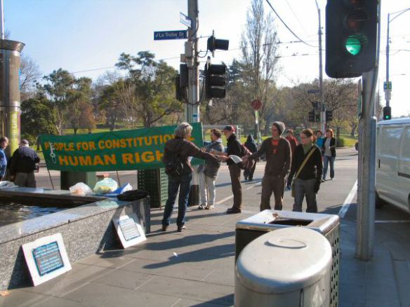 Handing leaflets to passersby