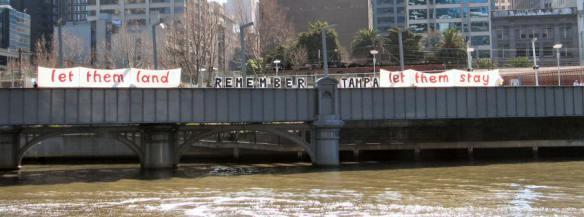 Let them land etc - banners on bridge