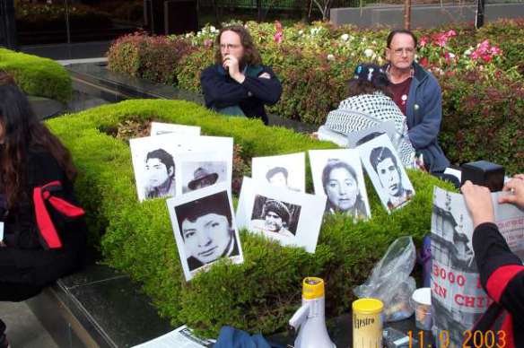 Photos of some victims of the coup on hedge at  Consulate