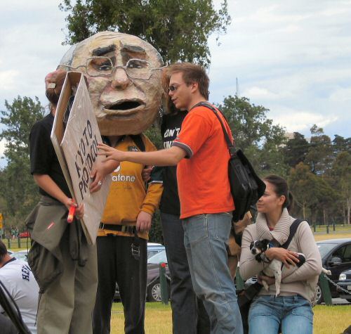 Puppet head of John Howard and activists with 'Kyoto Protocol'